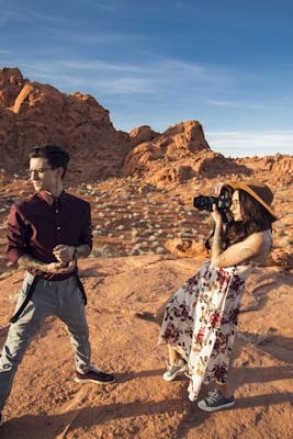 Person shooting photo in desert